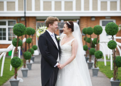 Bride and groom at stables at Newbury Racecourse
