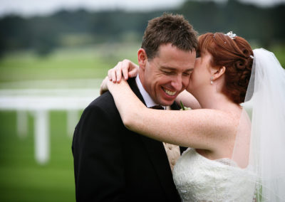 Bride and groom on the course at Newbury Racecourse